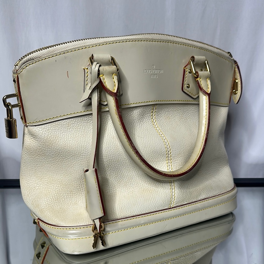 Louis Vuitton Cream Leather Handbag with lock and key